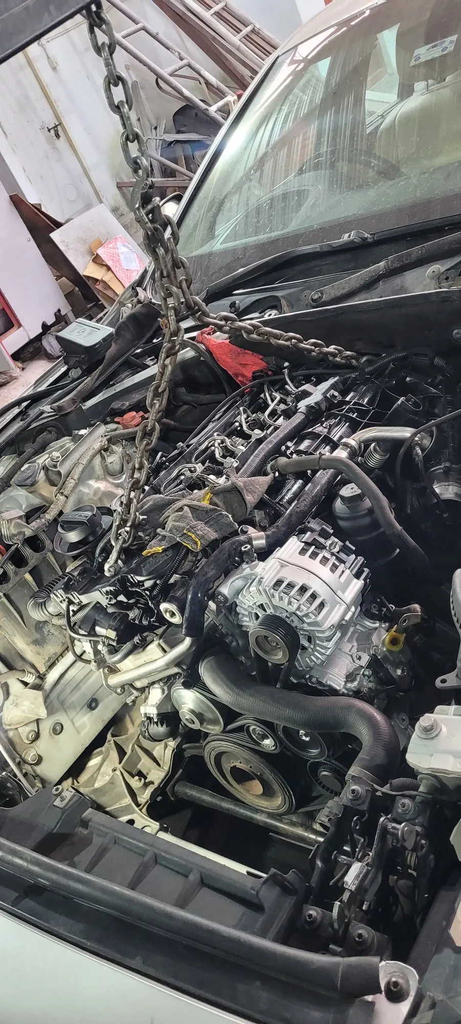 Premium car with the bonnet open in the workshop during diagnosis